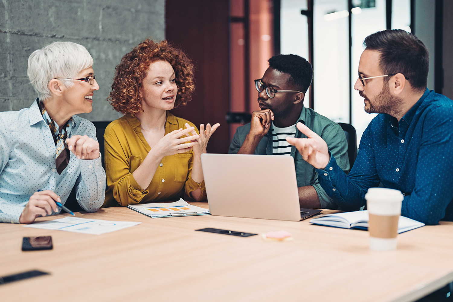 A group of professionals meeting in an office.