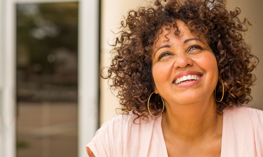 A mature woman smiling confidently