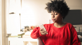 Young woman looking at her phone.