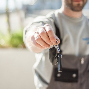 Man holding car keys.