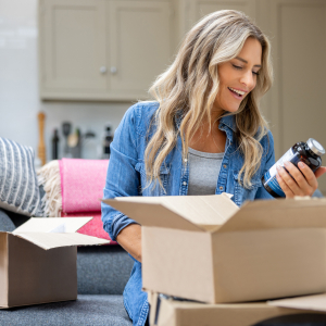 A woman opening a package