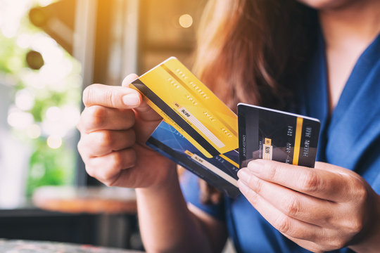 Closeup of a woman selecting a credit card