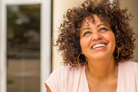 A mature woman smiling confidently