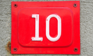 A red metal sign with the number ten in white.