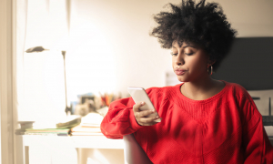 Young woman looking at her phone.